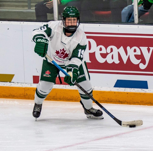 Mireille Martin A woman plays hockey
