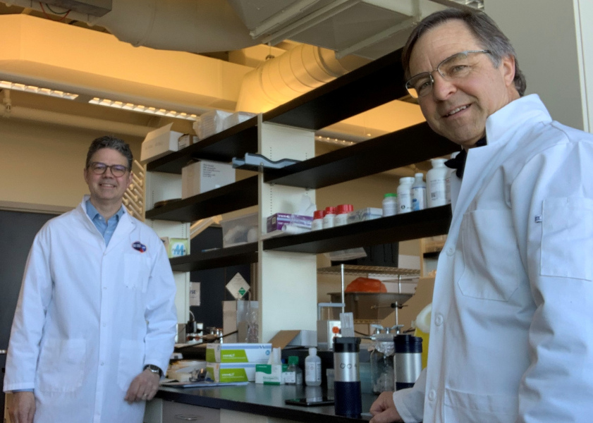 Dr. William Whelan and Dr. Andrew Trivett Two male scientists in a laboratory