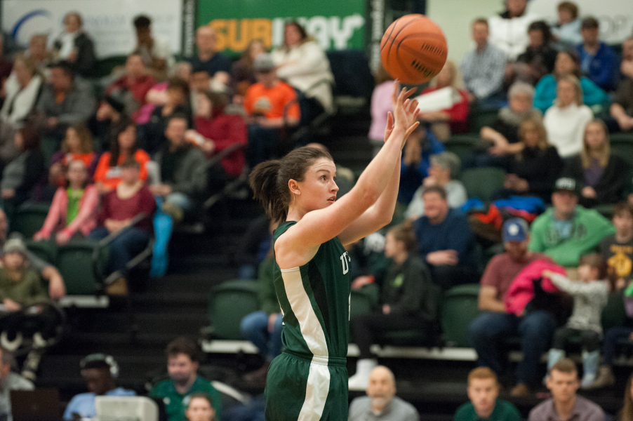 Jenna Mae Ellsworth A female basketball player shoots the ball