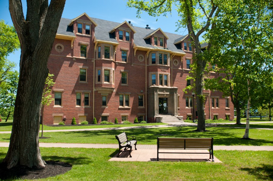UPEI's Dalton Hall A four-storey brick building with lush trees around it