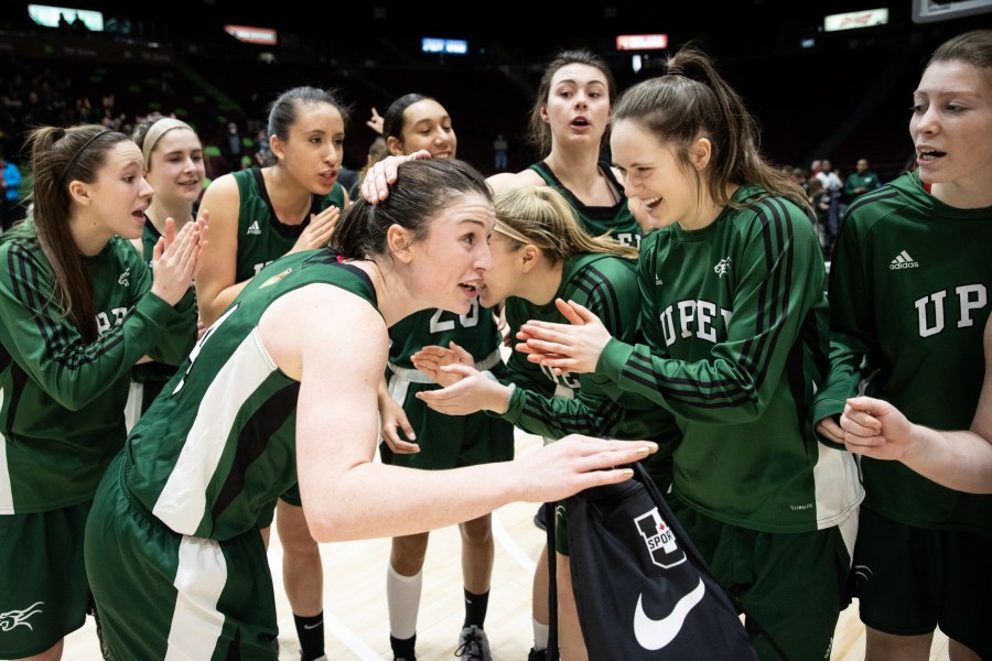 UPEI's Women's Basketball team (U SPORTS photo) A group of female basketball players congratulating each other after a game