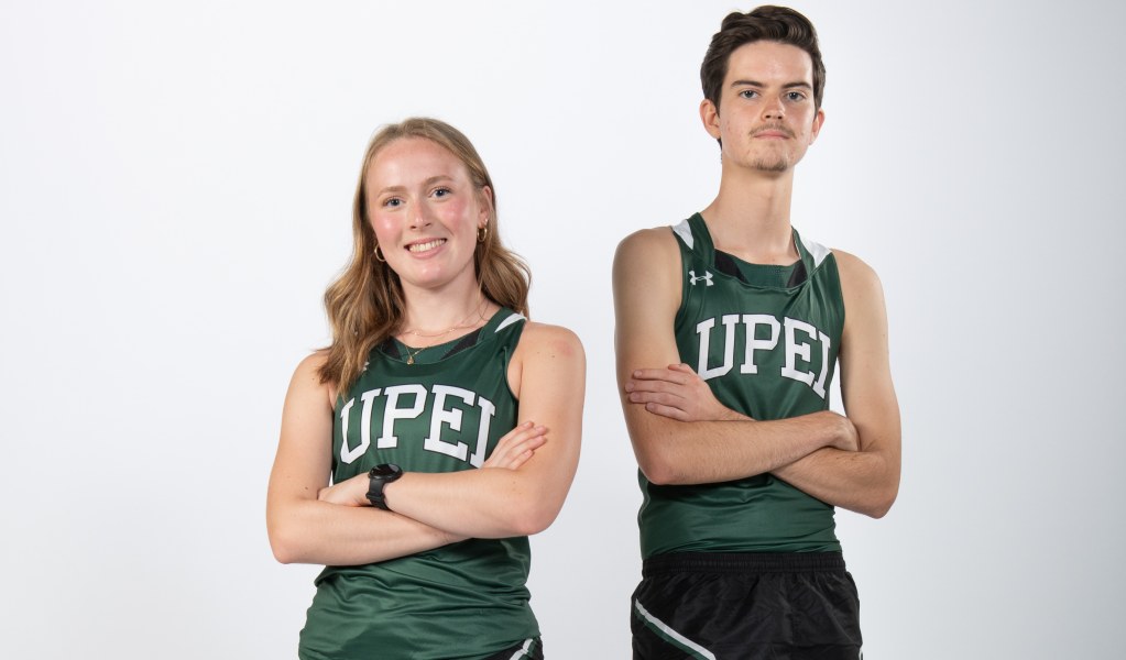 Ella Jenkins and Patrick Kenny A female and male athlete post for the camera with crossed arms, looking tough