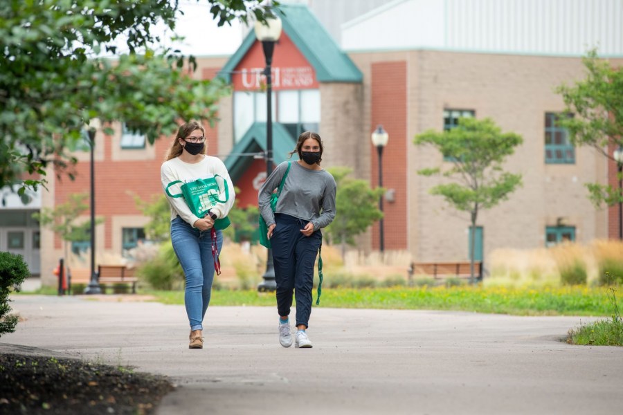 Students wearing masks stroll on the UPEI campus. Students wearing masks stroll on the UPEI campus.