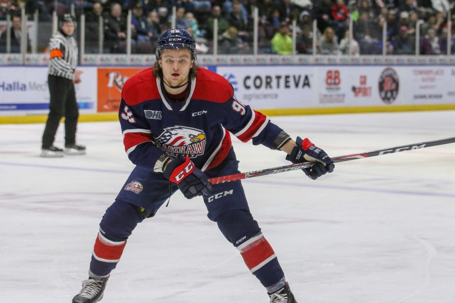Saginaw Spirit photo A male hockey player winds up for a shot on net
