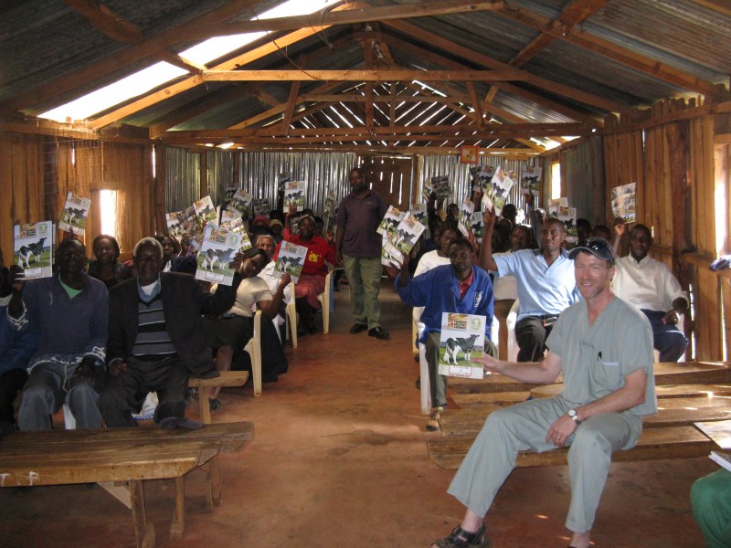 Dr. John VanLeeuwen provides education to smallholder dairy farmers during a previous visit to Kenya. Dr. John VanLeeuwen with smallholder dairy farmers in Kenya