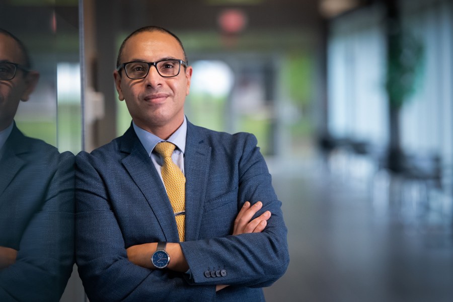 Dr. Tarek Mady has been appointed Dean of the Faculty of Business through to 2028 photo of man leaning against wall with arms folded