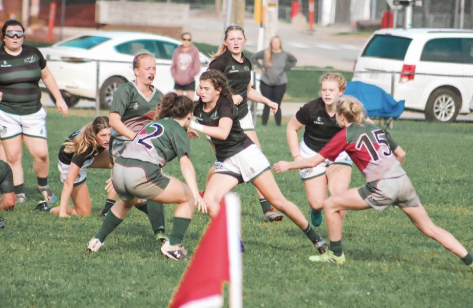 Rugby recruit Gracie McQuaid (centre) on the rugby pitch Rugby recruit Gracie McQuaid