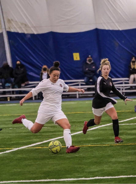 Charlottetown native Ria Johnston will join the UPEI Women's Soccer team this fall photo of woman kicking soccer ball