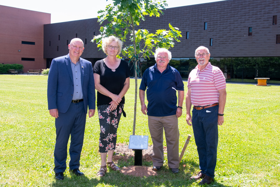 Dr. Greg Keefe, interim president and vice-chancellor of UPEI; Rosie MacFarlane, wife of Daryl Guignion; Bruce Smith, past president of the PEI Wildlife Federation; and Pat Doyle, past president of the Canadian Wildlife Federation Red oak tree dedication in memory of Daryl Guignion