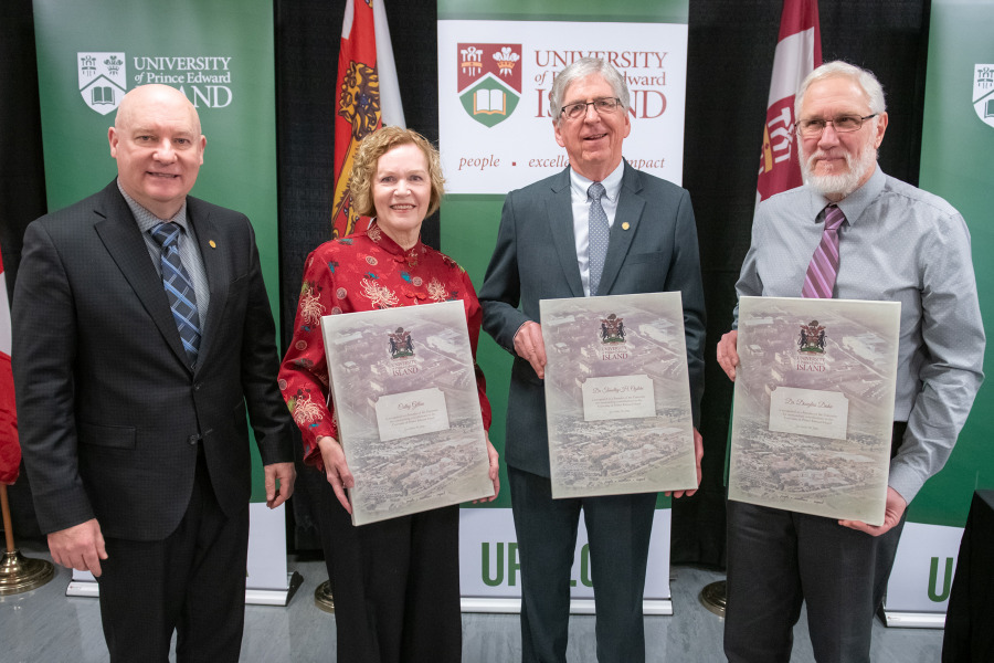 Dr. Greg Keefe, interim president and vice-chancellor of UPEI, congratulates Cathy Gillan, Dr. Timothy Ogilvie, and Dr. Douglas Dahn on being named 2022 Founders of the University of Prince Edward Island. 2022 Founders
