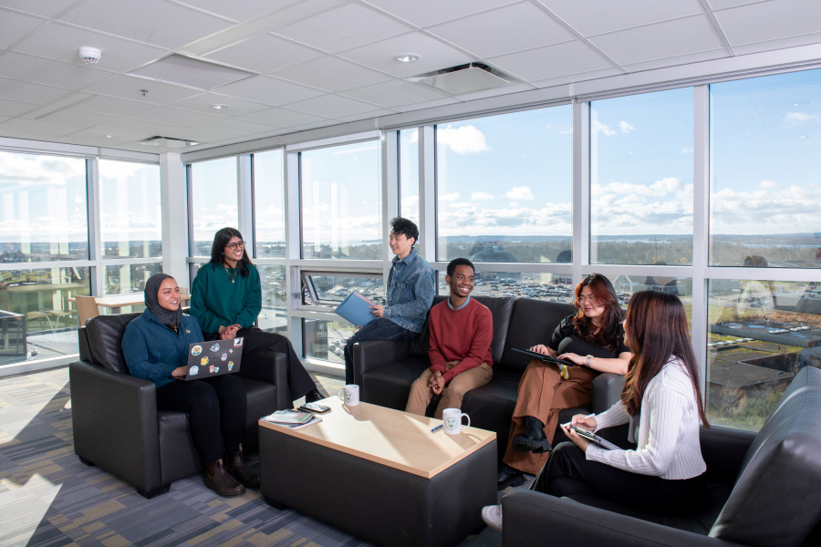 A group of international students gather in the ninth-floor lounge of the UPEI Performing Arts centre adn New Residence. International students