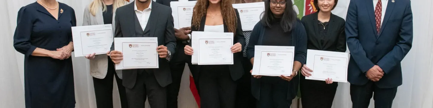 students holding awards